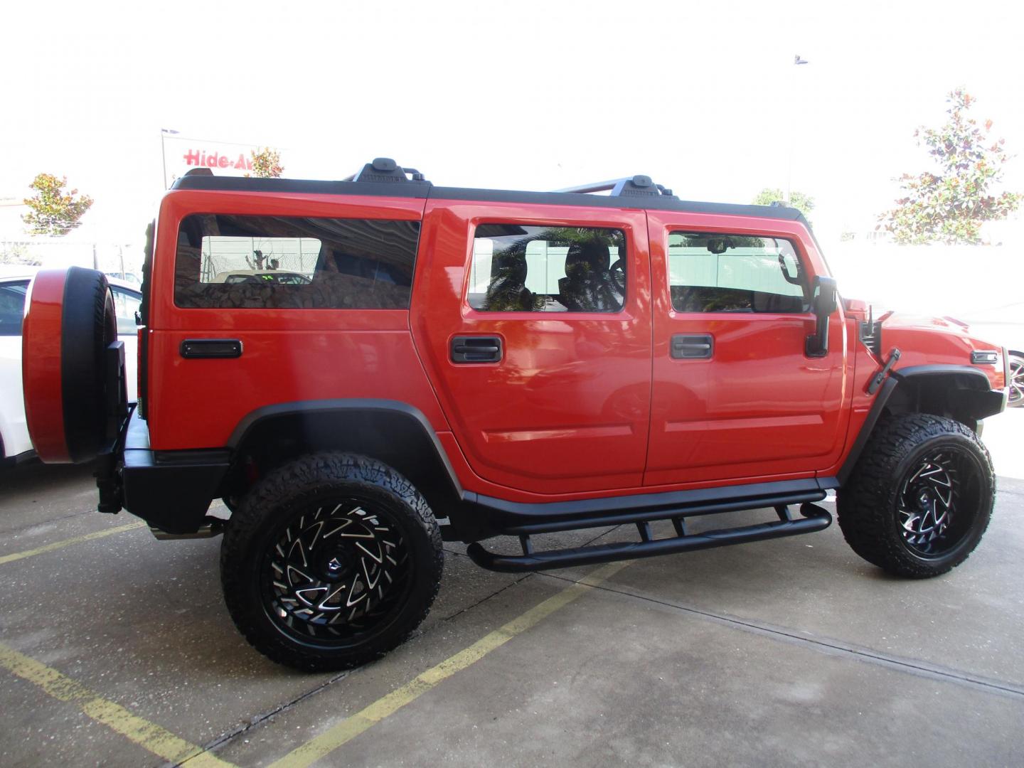 2008 Orange /Black HUMMER H2 Base (5GRGN23868H) with an 6.2L V8 OHV 16V engine, 6-Speed Automatic Overdrive transmission, located at 4724 53rd Ave East, Suite 1, Bradenton, FL, 34203, (941) 803-7117, 27.445360, -82.501678 - **AUTO DEALER SOLUTIONS**4724 53rd Ave ESuite 1Bradenton, Fl 34203941-803-71172008 HUMMER H2 5GRGN23868H10393454,256 MilesThis HUMMER H2 is literally new, over $50k spent on makeover, $10,000 paint job, all new leather throughout interior, new wheels and tires, all new trim accents. This H2 is an e - Photo#3