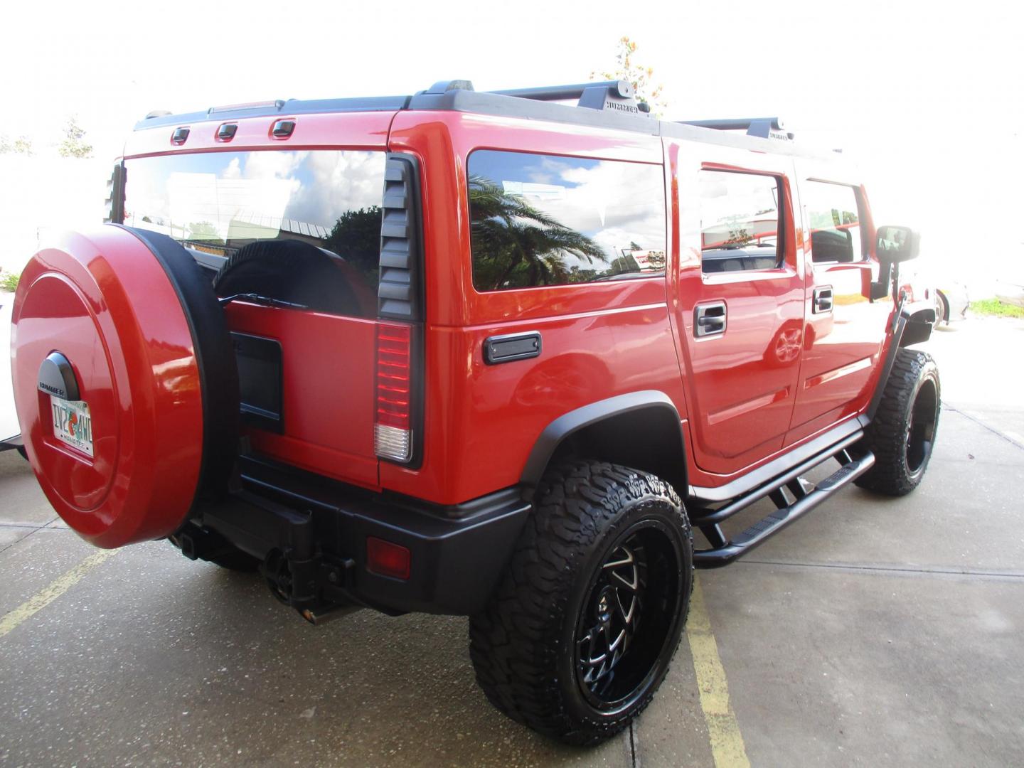 2008 Orange /Black HUMMER H2 Base (5GRGN23868H) with an 6.2L V8 OHV 16V engine, 6-Speed Automatic Overdrive transmission, located at 4724 53rd Ave East, Suite 1, Bradenton, FL, 34203, (941) 803-7117, 27.445360, -82.501678 - **AUTO DEALER SOLUTIONS**4724 53rd Ave ESuite 1Bradenton, Fl 34203941-803-71172008 HUMMER H2 5GRGN23868H10393454,256 MilesThis HUMMER H2 is literally new, over $50k spent on makeover, $10,000 paint job, all new leather throughout interior, new wheels and tires, all new trim accents. This H2 is an e - Photo#4