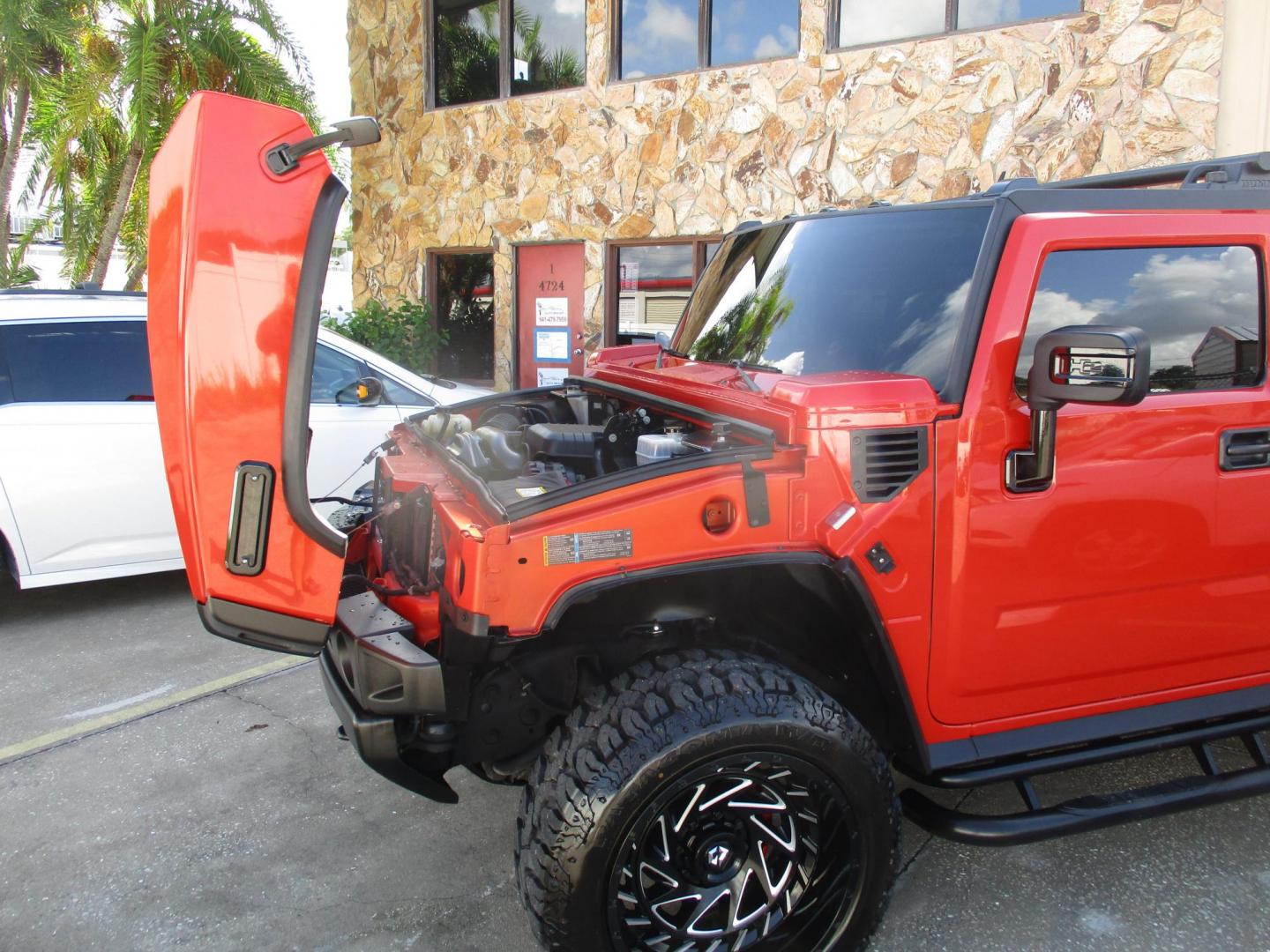 2008 Orange /Black HUMMER H2 Base (5GRGN23868H) with an 6.2L V8 OHV 16V engine, 6-Speed Automatic Overdrive transmission, located at 4724 53rd Ave East, Suite 1, Bradenton, FL, 34203, (941) 803-7117, 27.445360, -82.501678 - **AUTO DEALER SOLUTIONS**4724 53rd Ave ESuite 1Bradenton, Fl 34203941-803-71172008 HUMMER H2 5GRGN23868H10393454,256 MilesThis HUMMER H2 is literally new, over $50k spent on makeover, $10,000 paint job, all new leather throughout interior, new wheels and tires, all new trim accents. This H2 is an e - Photo#6